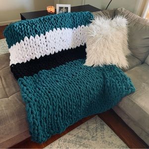 TEAM colored hand knitted chunky chenille throws. Solid one color throws, also.